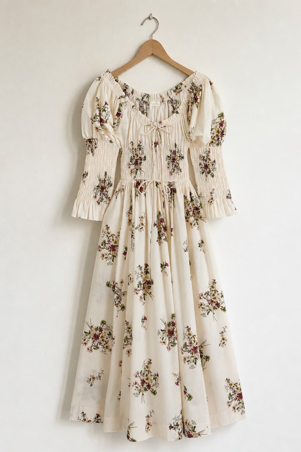 Floral midi dress laid flat — the original garment photo